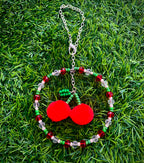 Handmade cherry rearview mirror car charm with fuzzy red pom poms and colorful beads