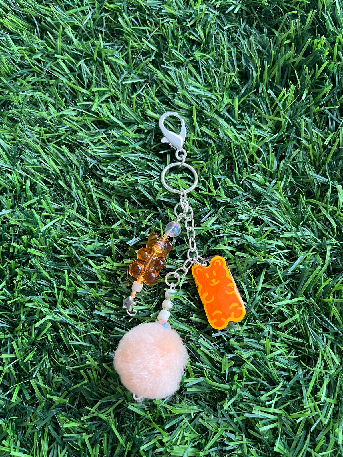 Purple gummy bear keychain with pom pom