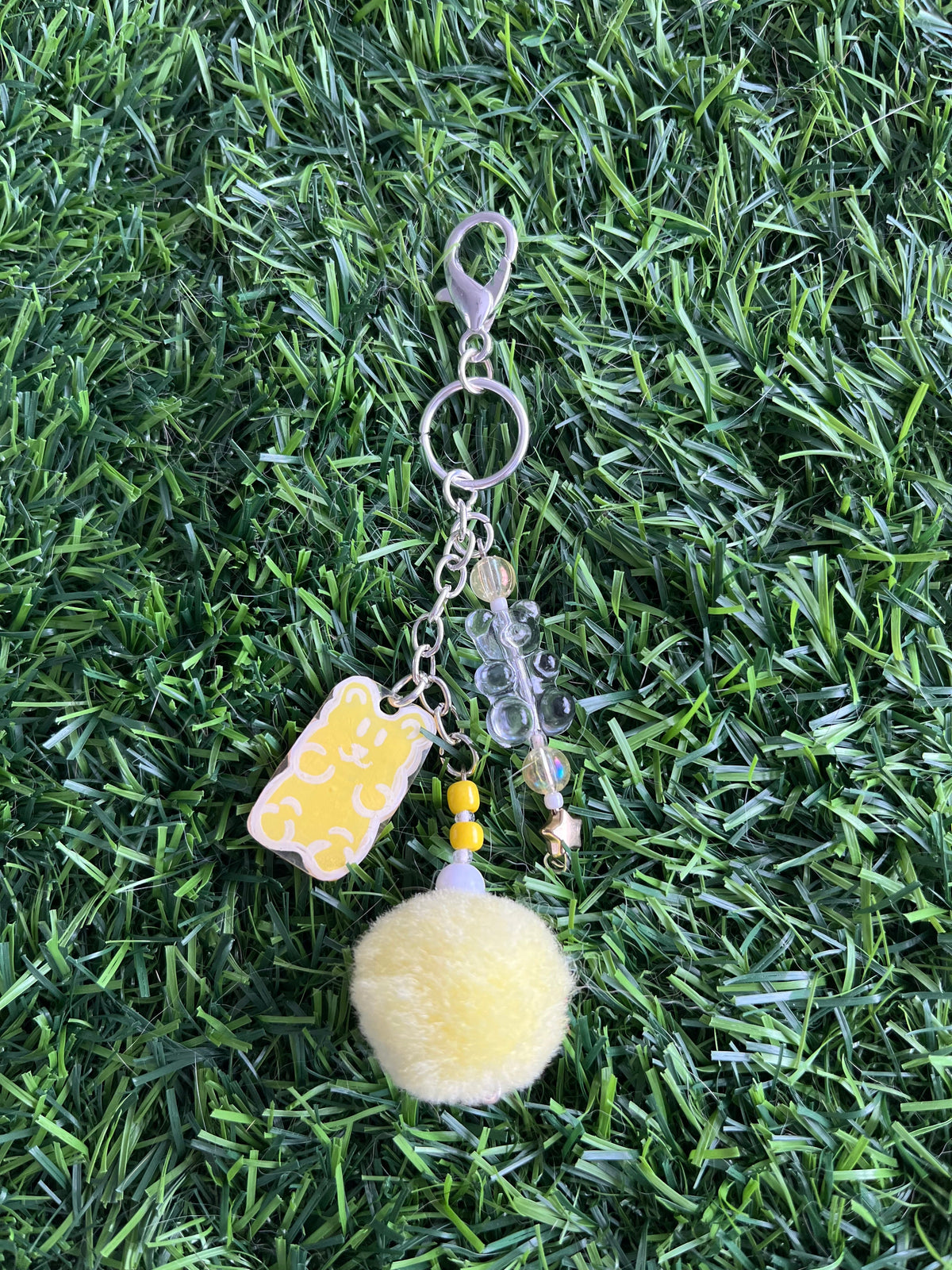 Red gummy bear keychain with pom pom