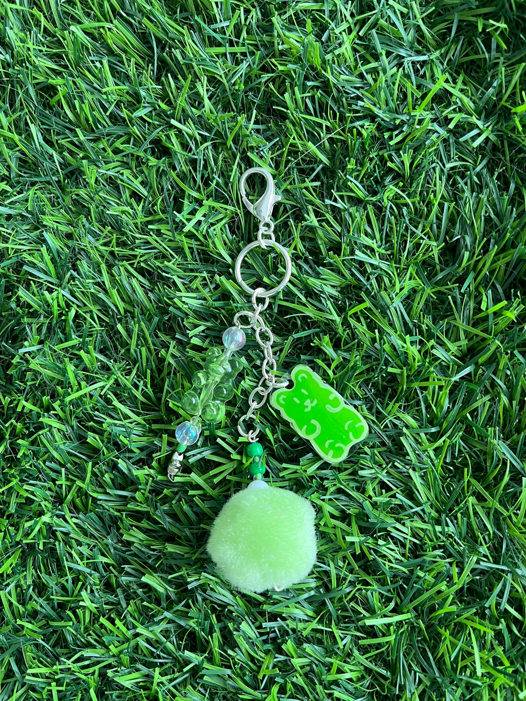 Orange gummy bear keychain with pom pom