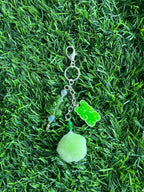 Orange gummy bear keychain with pom pom